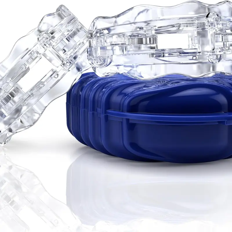 Clear Itus Mouthguardz night guards resting on their blue case