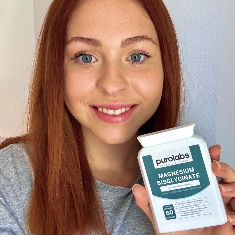 Customer holding PuroLabs Magnesium Bisglycinate